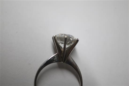 A platinum and solitaire diamond ring